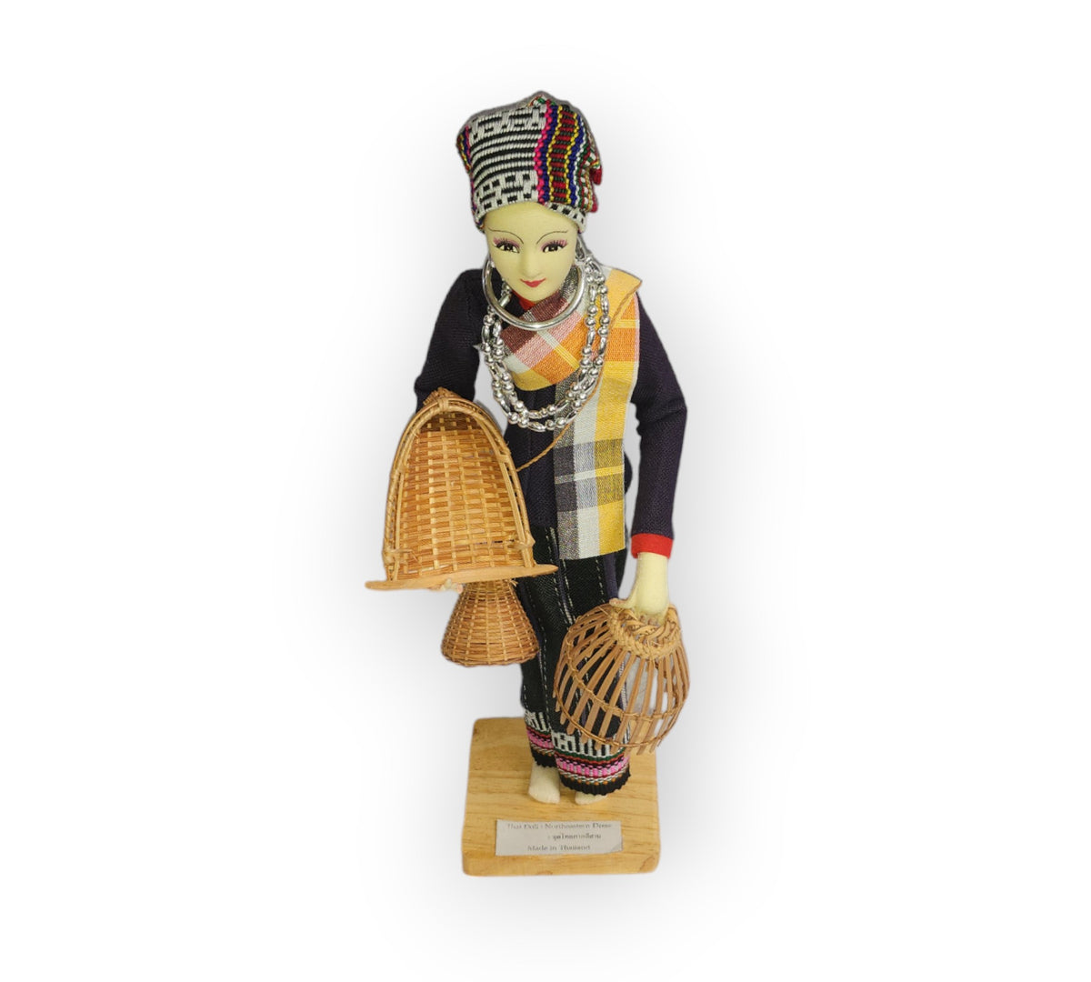 12-inch cloth doll in northeastern Thai dress, with a woven cap, silver-colored beads, and baskets, on a wood base