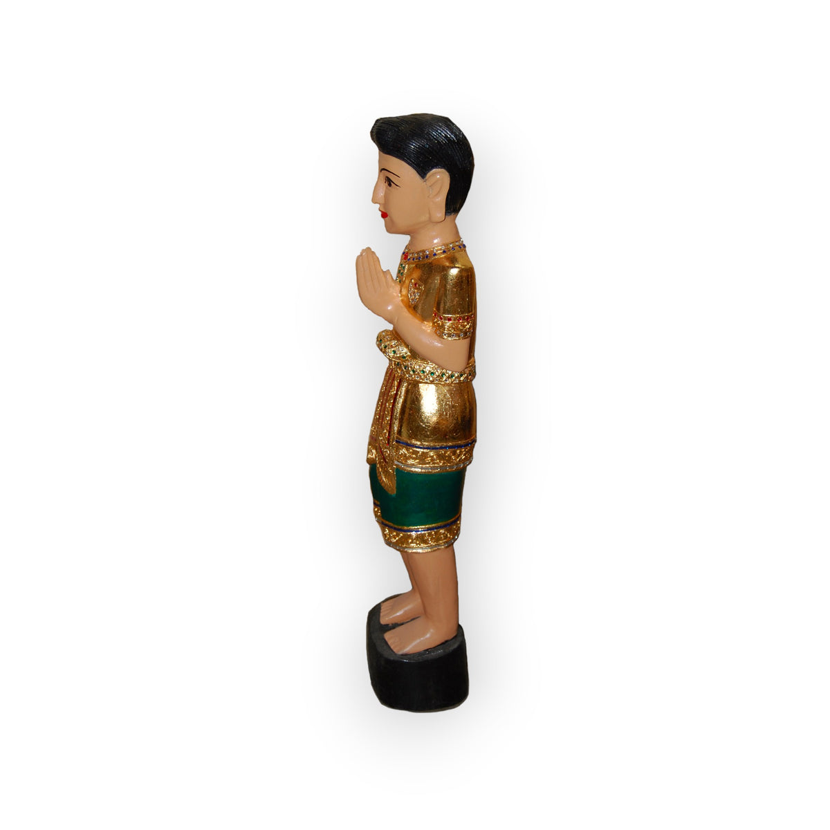 Carved wood Sawasdee statue of a Thai boy in green with hands together, side view