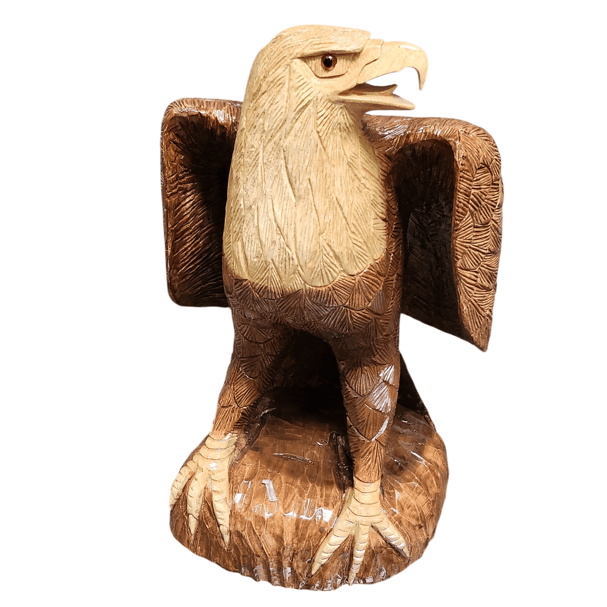 Carved wood eagle facing sideways, green background