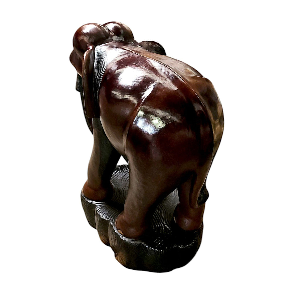 Rear view of the carved wood elephant showing the polished finish