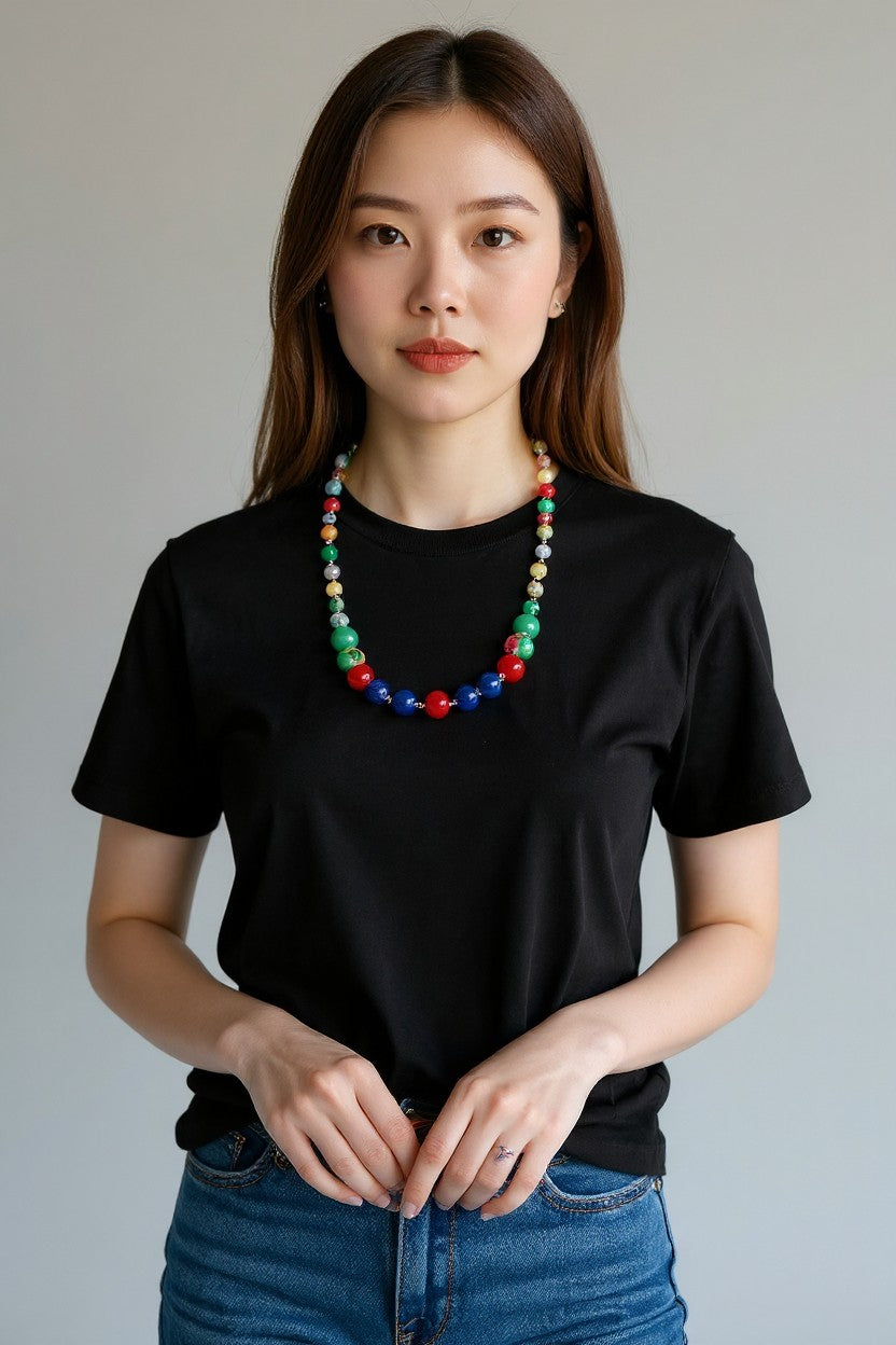 Model wearing the multi-color agate bead necklace with a black T-shirt