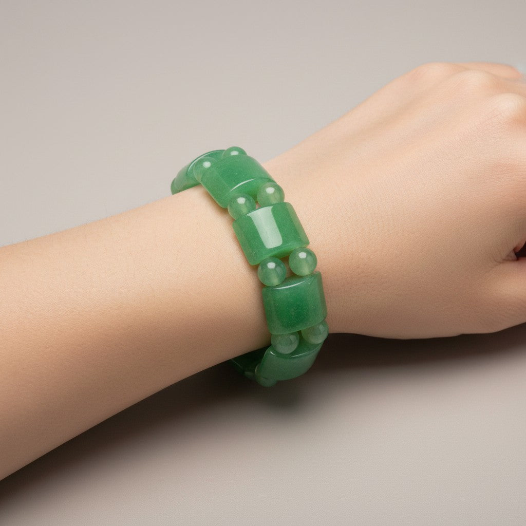 Green aventurine bracelet worn on a wrist