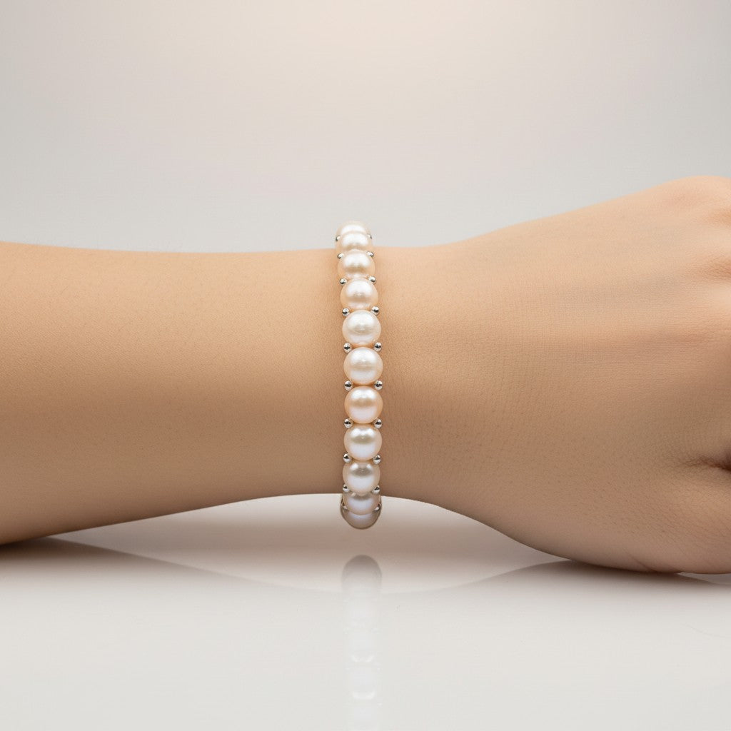 Pink pearl bracelet worn on a wrist