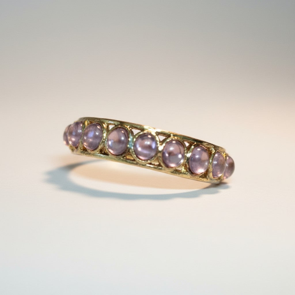 Dipped gold bangle with a row of lilac stones