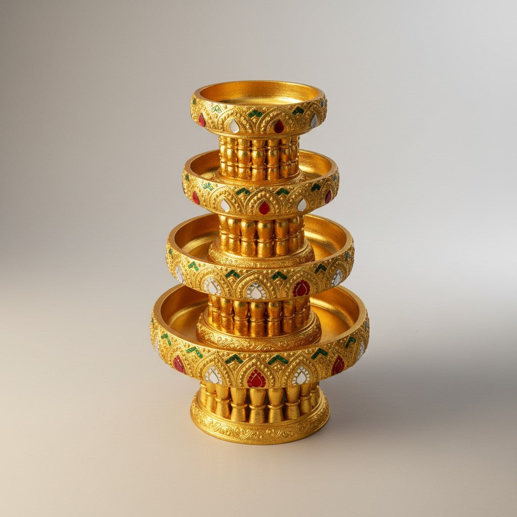Four-piece stacking ceremonial bowl set in gold finish with red trim