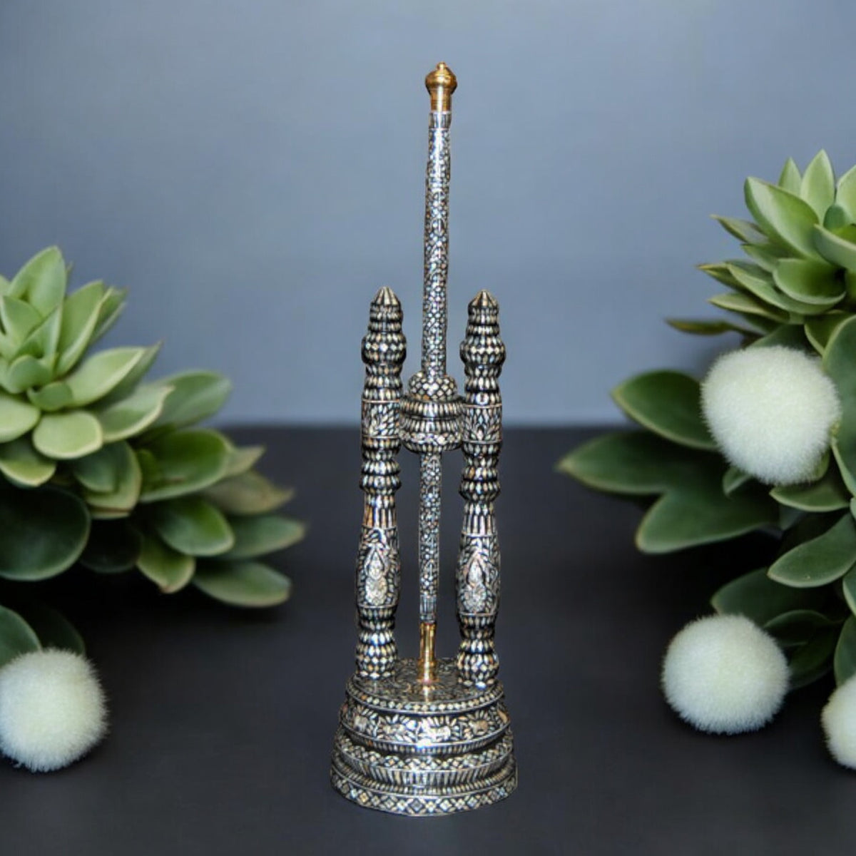 Silver-tone Buddhist ceremonial fan stand with pole, 27 inches, on a table