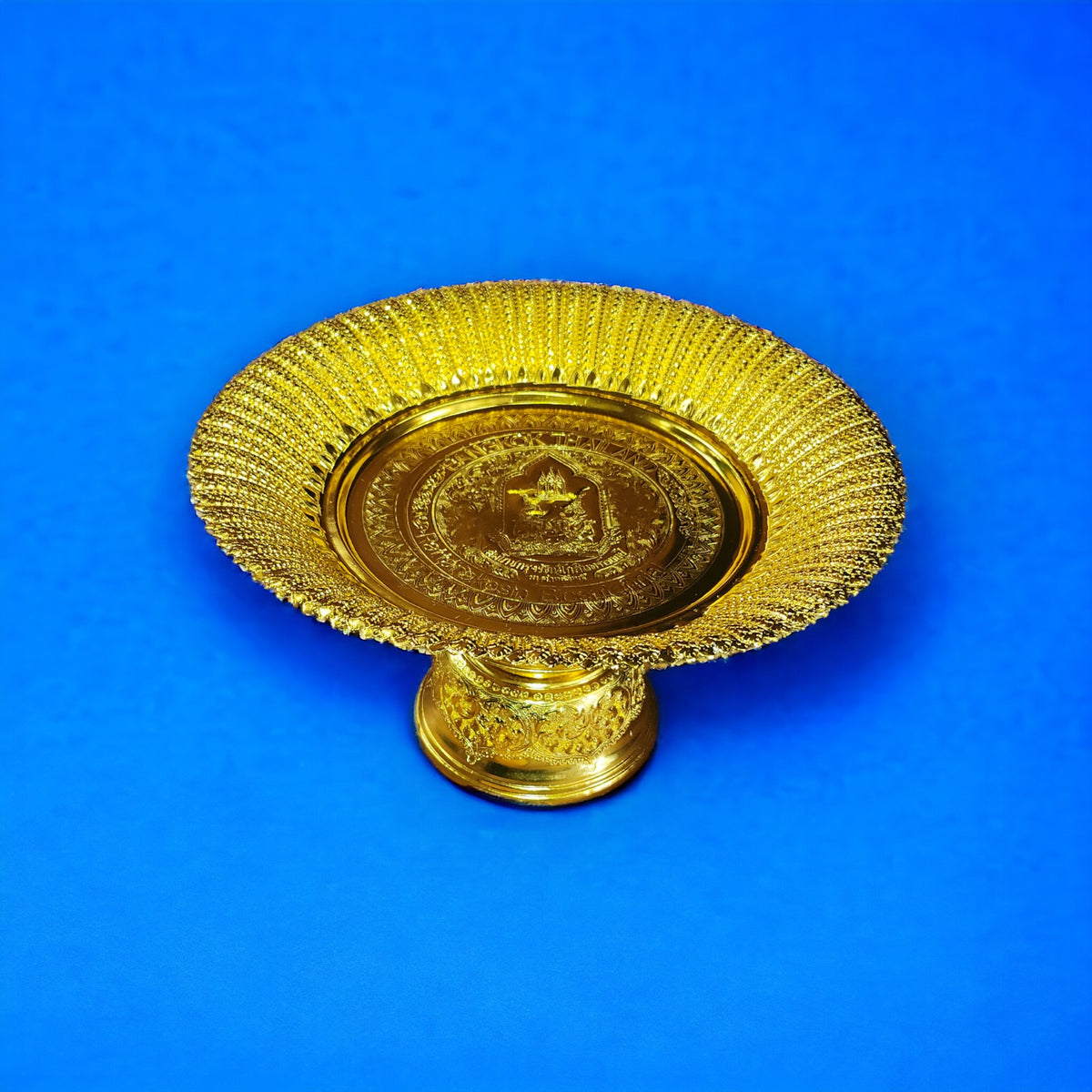 Gold aluminum offering tray on a pedestal foot with a ribbed rim, shown on a blue background