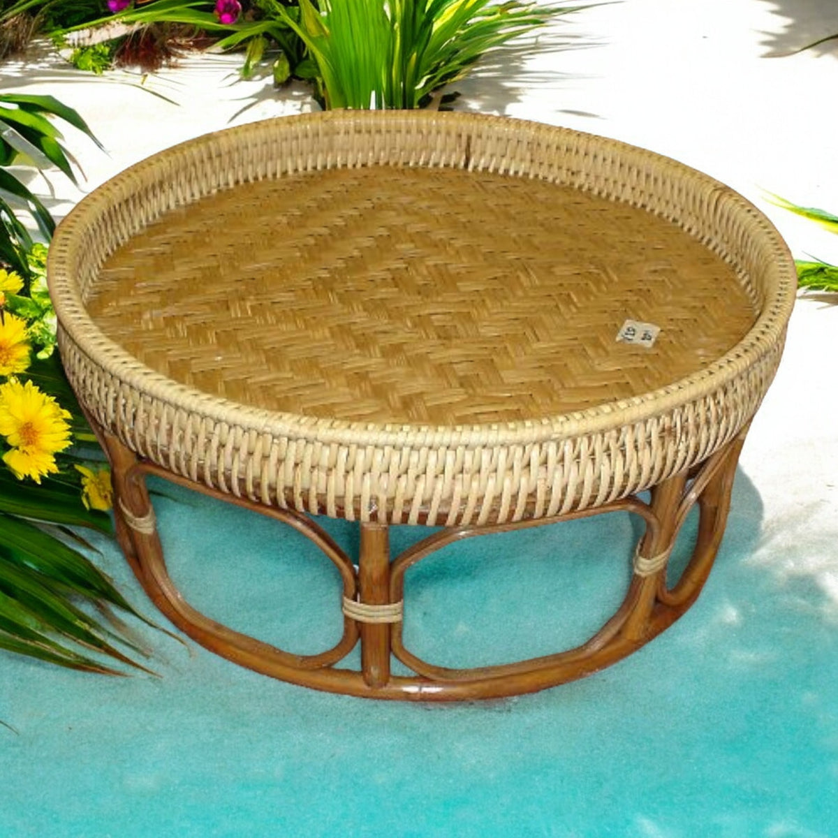 Rattan Khan Toke serving tray table with woven top, by a pool