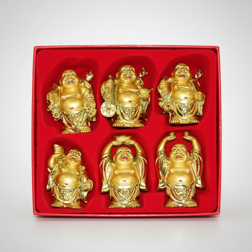 Boxed set of six gold Hotei figurines in different poses, each about 4 inches tall, in a red display box