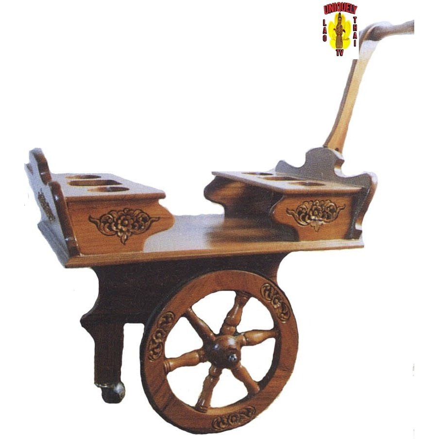 Natural teak portable bar cart on a wagon wheel with a long handle, carved side panels and two holders on top
