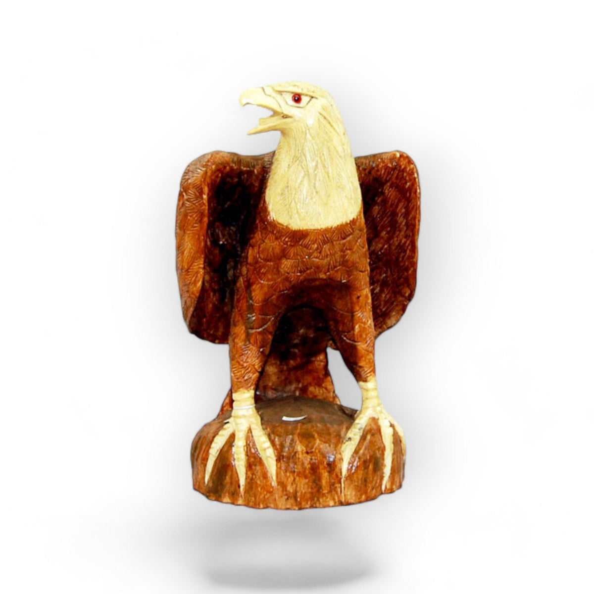 Carved wood bald eagle with wings raised on a natural base, third view
