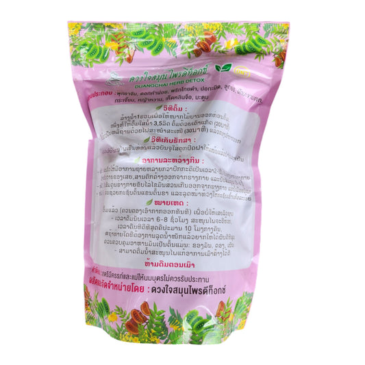Back of a pink herbal tea pouch with Thai-language label text and a green leaf border