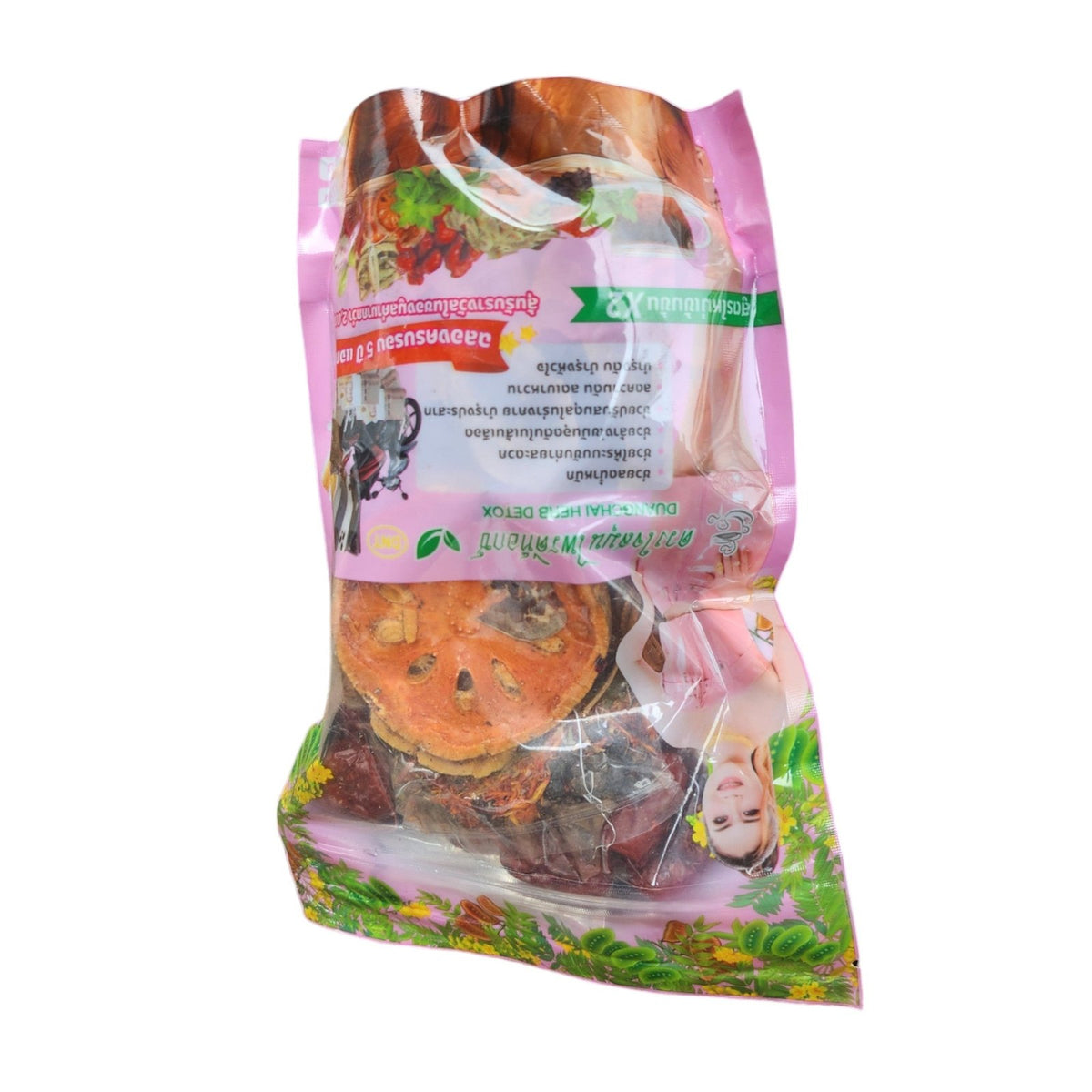 Pink herbal tea pouch on its side with dried fruit slices visible through the window